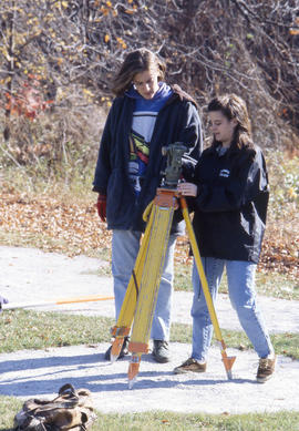 Photograph of Civil Engineering students using surveying equipment