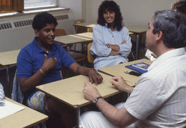 Photograph of students practicing sign language in class
