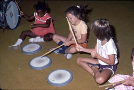 Photograph of Daycare Kids Playing With Drums