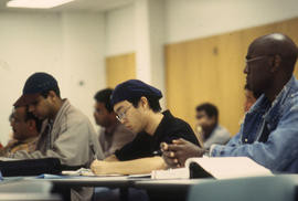 Photograph of students sitting in class listening to an unknown lecture