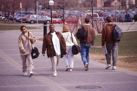 Photograph of students on campus walkway