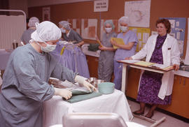 Photograph of instructor Susan Schulte directing an Operating Room Nurse training exercise
