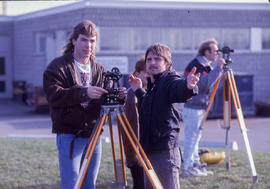 Photograph of Civil Engineering students using a transit