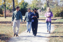 Photograph of a group of students on a stroll through the Arboretum