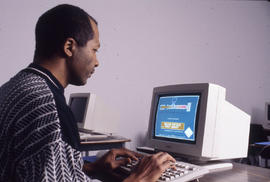 Photograph of a student seated at the computer