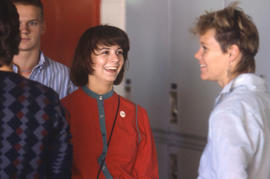 Photograph of students in conversation by the lockers in L building