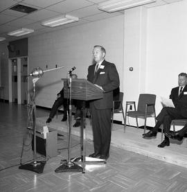 Photograph of an individual speaking at the opening of the D building (Field House)