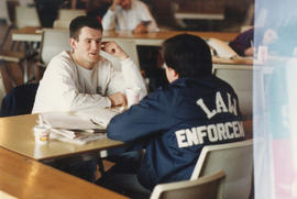 Photograph of students having lunch in the cafeteria