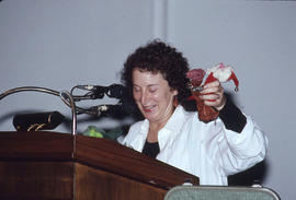 Photograph of Margaret Atwood standing at a podium