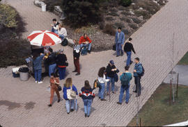 Photograph of People by The Hot Dog Stand