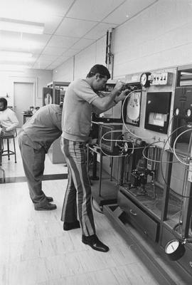 Photograph of Electronic Students Learning how to Pneumatic Equipment in the Lab