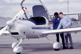 Photograph of an aviation instructor and student