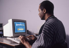Photograph of a person using a computer