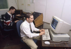 Photograph of students working in the radio broadcasting studio