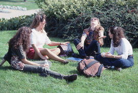 Photograph of Students Sitting on The Lawn Talking