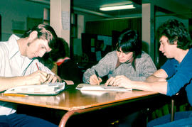 Photograph of Three Students Studying