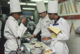 Photograph of students preparing food to serve in the Humber Room