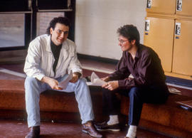 Photograph of two students sitting in Building L