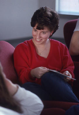 Photograph of a student attending a Mary Kay meeting