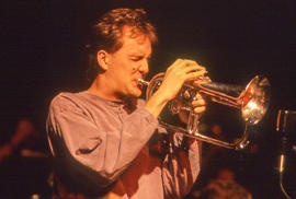 Photograph of a student performing and playing their musical instrument