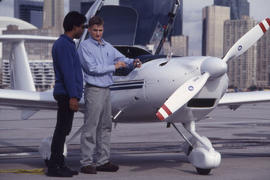 Photograph of an aviation instructor and a student