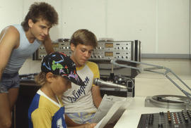 Photograph of persons in a broadcasting studio