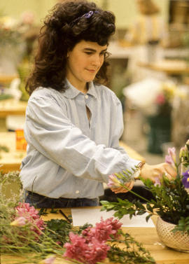 Photograph of a Retail Floristry student arranging flowers