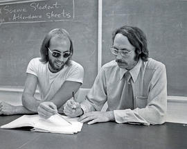 Photograph of Ron Geard Assisting a Student