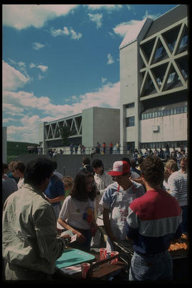 Photograph of Students at a BBQ Outside the Amphitheatre During a Log Throwing Event
