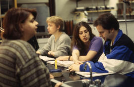 A photograph of students in class working on an assignment