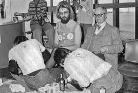 Photograph of Hugh Morrison Participating in the United Way Shoe Polishing Fundraiser