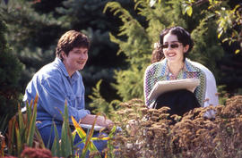 Photograph of students working at sketching in the Arboretum
