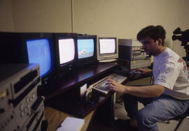 Photograph of a Student Using an Audio Visual Console