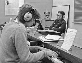 Photograph of Brian Harris Listening to His Student Perform a Musical Piece