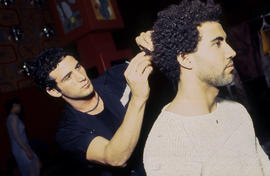 Photograph of hair stylist and model at fashion event