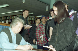 Photograph of Wayson Choy at a book signing