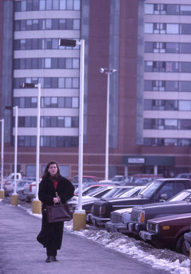 Photograph of student, faculty, or staff walking on campus