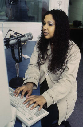 Photograph of student in Humber radio broadcasting studio