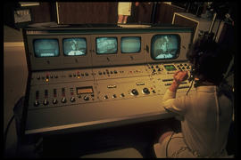 Photograph of a Student Working at a Video Console at the IMC