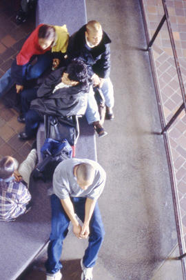 Photograph of students sitting in the concourse