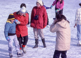 A photograph of people skating on the pond in the Arboretum