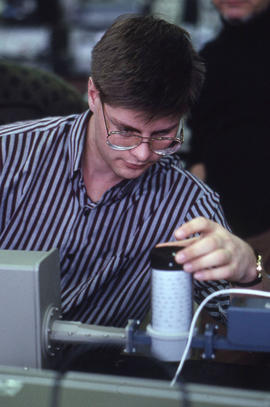 Photograph of a Technology instructor supervising use of electronic measurement equipment