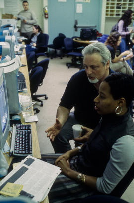 Photograph of professor Carey French assisting student