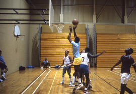 Photograph of students playing basketball in the Athletic Centre