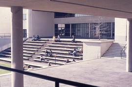 Students sitting in open-air KX : [photograph]
