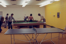 Photograph of Students Playing Pool in the Game Room