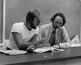 Photograph of Ron Geard and Mike Irwin Reviewing Course Material Together
