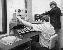 Photograph of Tony Hiscoke and Kelly Jenkins Working with Equipment at the IMC