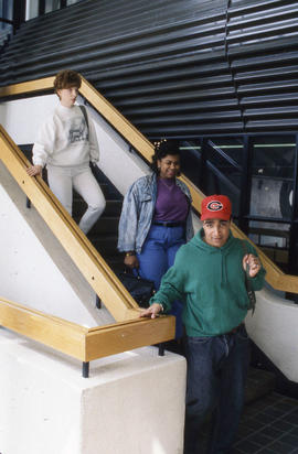 Photograph of People Coming Down the Stairs