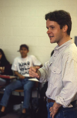 Photograph of a Student Speaking in a Classroom